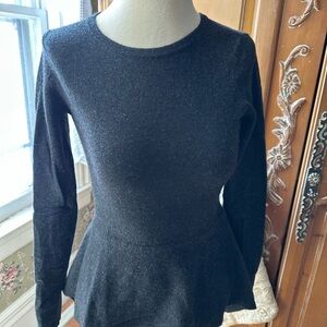 Elegant Black Peplum Top by Autumn Cashmere.